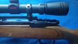 REMINGTON MODEL*798* LAMINATED STOCK -300 WINCHESTER MAGNUM with Removable muzzle brake, and a 3-9,x 40 mm redfield scope Mfg by Leupold duplex 98-99% - 15 of 16