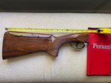 Perazzi MX8 or MX2000 with Adjustable comb sporting clays or Fitasc Stock for 12 gauge with drop out trigger.