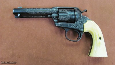 Colt Bisley SAA with 4 1/2 barrel, engraved and authentic ivory grips