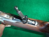WINCHESTER 1886
EARLY
.50 EXPRESS GOLD INLAID ENGRAVED – EXQUISITE RESTORATION -
MUST SEE!
- 9 of 15