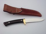 Jean Tanazacq custom made
full tang constructed model " RIEZE" Black micarta handle, single brass guard, brown leather scabbard, - 6 of 12
