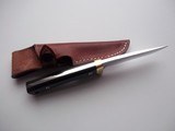 Jean Tanazacq custom made
full tang constructed model " RIEZE" Black micarta handle, single brass guard, brown leather scabbard, - 12 of 12