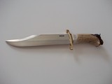 Randall Model # 12-11" Smithsonian Bowie Brass Lugged Guard India sambar crown Stag Handle carved with a American Bison/Buffalo
Spectacular Piec - 2 of 3