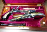 HISTORIC CASED PR OF PRESENATION
QUALITY HIGHLAND GOLD INLAIL ALL METAL FLINTLOCK PISTOLS BY WHEELER & SONE PRESENTED TO THE MARQUESS OF BREADALBANE
- 4 of 5
