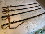 Four ww2 German officers sword, minty blade, two portapees,scabbards above good