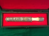 ANTIQUE ORNATE SILVER & BONE KNIFE WITH ORNATE SILVER SHEATH COMES IN A RED FELT LINED BOX. - 1 of 13