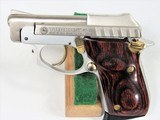 TAURUS PT 22 STAINLESS WITH GOLD ACCENTS. - 3 of 6