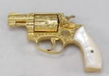 SMITH & WESSON, MODEL 36, "ENGRAVED & GOLD PLATED"
- 2 of 21
