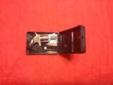 .22 North American Arms mini revolver with
- 1 of 2