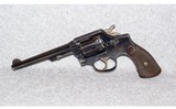 Smith & Wesson~M&P Hand Ejector~S&W 38 Mil. - 2 of 3