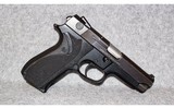 Smith & Wesson~Model 3944~9mm Luger - 1 of 2