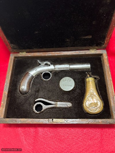 VERY RARE ANTIQUE Bacon & Company .36 Cal Single Shot Ring Trigger Pistol with antique display case and accessories
