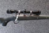 Ruger 77/22 Stainless w/ Skeleton Stock
- 8 of 8