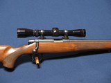 REMINGTON 504 22LR W/LEUPOLD 2X7 - 1 of 8