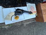 A pair of Colt John Wayne Commemorative Single Action Army revolvers in 45LC. As new, never cocked and with new factory display cases. - 5 of 8