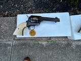 A pair of Colt John Wayne Commemorative Single Action Army revolvers in 45LC. As new, never cocked and with new factory display cases. - 4 of 8