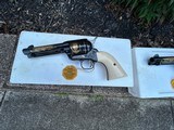 A pair of Colt John Wayne Commemorative Single Action Army revolvers in 45LC. As new, never cocked and with new factory display cases. - 2 of 8
