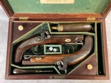 Cased Set T. Wilson Percussion Pocket Coat Pistols in original factory case with accoutrements - 1 of 15