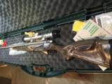 Mossberg 4x4 Ducks Unlimited 300 win mag with scope - 1 of 4