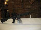 BUSHMASTER CARBON-15 AR RIFLE WITH 1X30ST SCOPE - 1 of 2