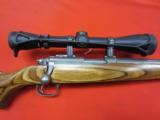 Ruger M77/22 22 Magnum Stainless/Laminate w/ Leupold
- 1 of 6