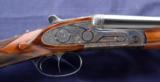 Used Arrieta 28ga double barrel side lock shotgun.
- 5 of 9