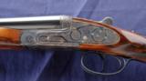 Used Arrieta 28ga double barrel side lock shotgun.
- 8 of 9