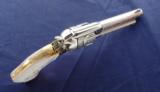 Colt SAA 2nd Generation Alvin A White engraved
Nickel .45 Colt with Mother of Pearl Grips.
- 9 of 14