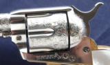 Colt SAA 2nd Generation Alvin A White engraved
Nickel .45 Colt with Mother of Pearl Grips.
- 12 of 14