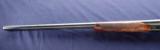 Winchester Model 21 chambered in 12ga 2-3/4” with a 1779XX serial number and 28 - 11 of 12