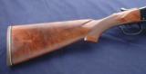Winchester Model 21 chambered in 12ga 2-3/4” with a 1779XX serial number and 28 - 2 of 12