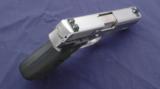 Kahr K9 Elite 03 chambered in 9mm with Crimson Trace laser grips. - 2 of 5