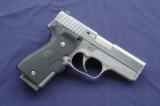 Kahr K9 Elite 03 chambered in 9mm with Crimson Trace laser grips. - 1 of 5