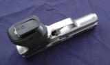 Kahr K9 Elite 03 chambered in 9mm with Crimson Trace laser grips. - 3 of 5