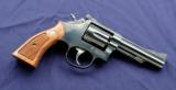 Smith & Wesson Model 15-6 K-38 Masterpiece chambered in .38 spl with a 4” heavy barrel and box. - 1 of 7