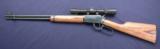 Winchester 9422 chambered in .22 lr. 2.5 X 7 Weaver and laminated wood stock. - 1 of 11