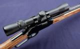 Winchester 9422 chambered in .22 lr. 2.5 X 7 Weaver and laminated wood stock. - 4 of 11