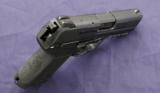 HK 45C chambered in .45acp and is like new in box with 2 mags - 2 of 5