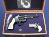 Cased pair, S&W 38/44 revolver and Cobra derringer - 1 of 8