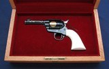 Colt Texas Sesquicentennial in display case with ivory