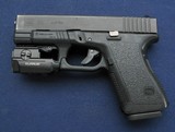 Used Glock 23 Gen2 w/ weaponlight - 1 of 7