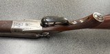 Ketner Hammer shotgun.
12g. Sauer action Damascus - 9 of 14