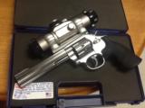 Smith & Wesson stainless model 617-6 6in 22lr 10 shot tasco pro point - 1 of 3