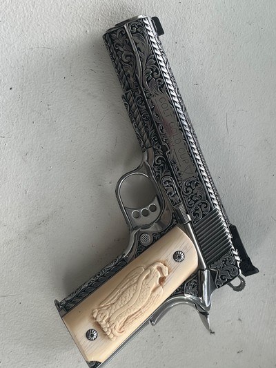 Outstanding engraved clot stainless gold cup with antique carved ivory grips