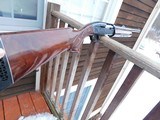 Remington 1100 Deer Gun With Factory Slug Barrel and sights - 1 of 12