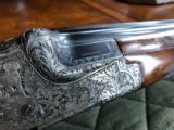 *SALE PENDING*Merkel 203-E - 16 gauge - SST - Hand Detachable Sidelock Ejector - Solid Rib - Hand Engraved - 3 Piece Forend - Hand Carved Stock Grip - 8 of 24