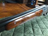 *SALE PENDING*Merkel 203-E - 16 gauge - SST - Hand Detachable Sidelock Ejector - Solid Rib - Hand Engraved - 3 Piece Forend - Hand Carved Stock Grip - 20 of 24