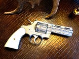 Colt Python .357 Magnum - Master Engraver Robert Valade - 4” - Nickel -
Deep Western Scroll Engraving - Like New - 1 of 25