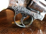 Colt Python .357 Magnum - Master Engraver Robert Valade - 4” - Nickel -
Deep Western Scroll Engraving - Like New - 8 of 25
