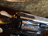 Colt Python .357 Magnum - Master Engraver Robert Valade - 4” - Nickel -
Deep Western Scroll Engraving - Like New - 16 of 25